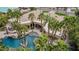 Aerial view of a grand home with an exceptional pool area, featuring a grotto, slide, and covered patio at 2494 E Cloud Dr, Chandler, AZ 85249