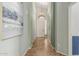 Hallway features tile floors and neutral paint with an art piece hanging on the wall and a decorative light fixture at 3055 N Red Mtn # 77, Mesa, AZ 85207