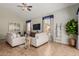 Open living room featuring two sofas, a glass coffee table, TV, and plenty of natural light at 3055 N Red Mtn # 77, Mesa, AZ 85207