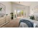 Another view of the spacious main bedroom that includes sliding glass door and pool views at 3055 N Red Mtn # 77, Mesa, AZ 85207