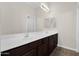 Bathroom features double vanity and dark wood cabinets at 4336 S Pony Rider Trl, Gold Canyon, AZ 85118