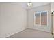 Bright bedroom with carpeted floor, neutral walls, and window blinds at 4336 S Pony Rider Trl, Gold Canyon, AZ 85118