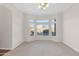 Spacious bedroom with large window and neutral wall colors at 4336 S Pony Rider Trl, Gold Canyon, AZ 85118