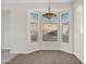 Dining area with tiled floor and a bay window at 4336 S Pony Rider Trl, Gold Canyon, AZ 85118