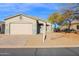 Single-story house with a two-car garage and desert landscaping at 4336 S Pony Rider Trl, Gold Canyon, AZ 85118