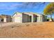 House exterior with a two-car garage and desert landscaping at 4336 S Pony Rider Trl, Gold Canyon, AZ 85118