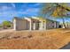 House exterior with neutral color scheme and front yard at 4336 S Pony Rider Trl, Gold Canyon, AZ 85118