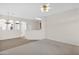 Living room with a view into the kitchen and a half wall at 4336 S Pony Rider Trl, Gold Canyon, AZ 85118