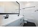 Bathroom showcasing a double sink vanity and a shower-tub combo at 1300 E Penedes Dr, Gilbert, AZ 85298