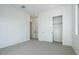 Bright bedroom with closet, neutral paint, carpet, and modern lighting at 1300 E Penedes Dr, Gilbert, AZ 85298