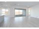 Bright living room with sliding glass doors and white walls at 1300 E Penedes Dr, Gilbert, AZ 85298