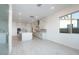 Modern open kitchen with an island and bright living area at 1300 E Penedes Dr, Gilbert, AZ 85298