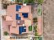 Aerial view of roof with solar panels, patio, and miniature putting green in backyard at 1017 E Grandview Rd, Phoenix, AZ 85022