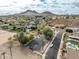Community aerial view of neighborhood with desert landscaping, parks, and mountain views at 1017 E Grandview Rd, Phoenix, AZ 85022