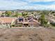 Aerial view of backyard featuring solar panels on tile roof, landscaping, and block wall at 1017 E Grandview Rd, Phoenix, AZ 85022