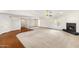 Open concept living room with a fireplace, hardwood accents, and ample space at 1017 E Grandview Rd, Phoenix, AZ 85022