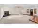 Bright living room featuring a fireplace, hardwood flooring, and a ceiling fan at 1017 E Grandview Rd, Phoenix, AZ 85022