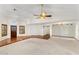 Spacious living room boasting hardwood floors, natural light, and an elegant ceiling fan at 1017 E Grandview Rd, Phoenix, AZ 85022