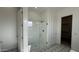 Bright bathroom featuring a glass-enclosed shower, star-patterned flooring, and a clean, modern design at 11465 E Utah Ave, Mesa, AZ 85212