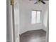 Small bedroom featuring neutral walls, a window, a ceiling fan, and modern gray flooring at 11560 W Kinderman Dr, Avondale, AZ 85323