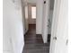 Hallway featuring neutral walls and modern gray flooring at 11560 W Kinderman Dr, Avondale, AZ 85323