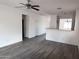 Open living space featuring an open floor plan, neutral walls, and modern gray flooring at 11560 W Kinderman Dr, Avondale, AZ 85323