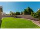 Expansive backyard featuring green lawn and trees at 22364 N 67Th Dr, Glendale, AZ 85310