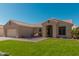 Charming single-story home featuring a well-manicured lawn and tile roof at 22364 N 67Th Dr, Glendale, AZ 85310
