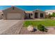 Charming single-story home featuring a well-manicured lawn and tile roof at 22364 N 67Th Dr, Glendale, AZ 85310