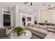 Open-concept living room with modern furnishings and neutral color palette at 22364 N 67Th Dr, Glendale, AZ 85310