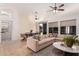Spacious living room featuring a large sectional sofa and tile flooring at 22364 N 67Th Dr, Glendale, AZ 85310