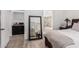 Bright primary bedroom featuring wood floors, ensuite bath, walk in closet at 22364 N 67Th Dr, Glendale, AZ 85310