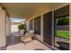 Covered patio with outdoor seating and sliding glass door at 22364 N 67Th Dr, Glendale, AZ 85310