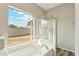 Bathroom featuring soaking tub under window and walk-in shower at 6658 E San Cristobal Way, Gold Canyon, AZ 85118