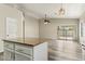 Bright, modern kitchen with granite countertops, stainless steel appliances, white cabinets, and a view into the open living space at 6658 E San Cristobal Way, Gold Canyon, AZ 85118
