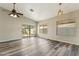 Spacious living area features a ceiling fan, vinyl flooring and a sliding door providing access to a backyard patio at 6658 E San Cristobal Way, Gold Canyon, AZ 85118