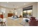 Spacious bedroom with modern furnishings, neutral tones and a patio view at 7928 E Parkview Ln, Scottsdale, AZ 85255