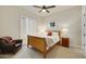 Bedroom with a ceiling fan, natural light, and neutral colored walls at 7928 E Parkview Ln, Scottsdale, AZ 85255