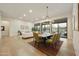 Open dining area featuring neutral tones, modern decor, and backyard views with ample seating at 7928 E Parkview Ln, Scottsdale, AZ 85255