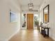 Bright foyer with wood flooring, a modern light fixture, and views to the outside at 7928 E Parkview Ln, Scottsdale, AZ 85255