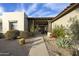 Charming front entrance with desert landscaping and a covered walkway to the front door at 7928 E Parkview Ln, Scottsdale, AZ 85255