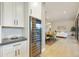 Kitchen area showing countertops, cabinets, and a wine cooler, with a view into an adjoining dining area at 7928 E Parkview Ln, Scottsdale, AZ 85255
