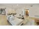 Spacious living room with neutral decor, modern lighting, and wood floors throughout at 7928 E Parkview Ln, Scottsdale, AZ 85255