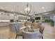Spacious living room with modern finishes featuring a kitchen and an adjoining living space at 7928 E Parkview Ln, Scottsdale, AZ 85255