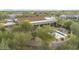 Aerial view of desert home with large patio area, outdoor seating, and a private pool at 7928 E Parkview Ln, Scottsdale, AZ 85255