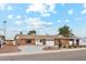 Brick ranch home with a two-car garage and driveway at 8644 E Bonnie Rose Ave, Scottsdale, AZ 85250