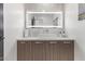 Contemporary powder room with a minimalist sink and wood vanity at 9027 N 82Nd St, Scottsdale, AZ 85258