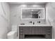 Modern bathroom with a floating vanity, sleek mirror, and designer finishes at 9027 N 82Nd St, Scottsdale, AZ 85258