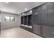 Convenient laundry room with built-in cabinetry and ample storage at 9027 N 82Nd St, Scottsdale, AZ 85258