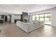 Spacious living area featuring a large sectional sofa and a modern fireplace at 9027 N 82Nd St, Scottsdale, AZ 85258